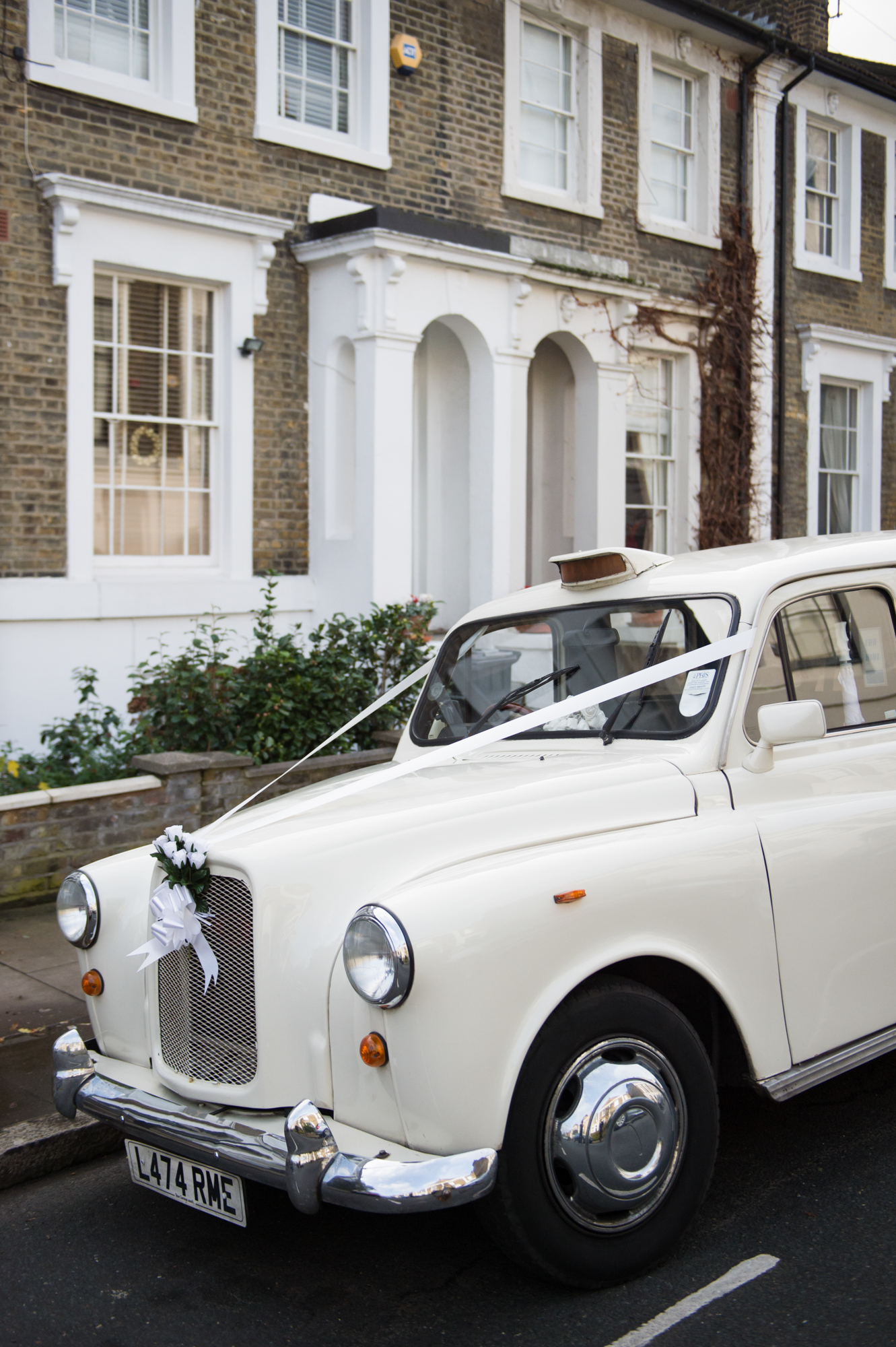 white london black cab wedding car with ribbons
